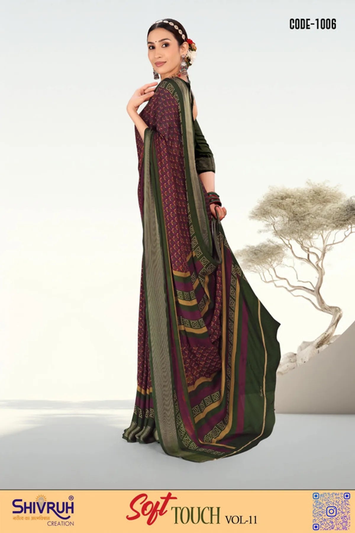 Women saree in teal green with silver motifs