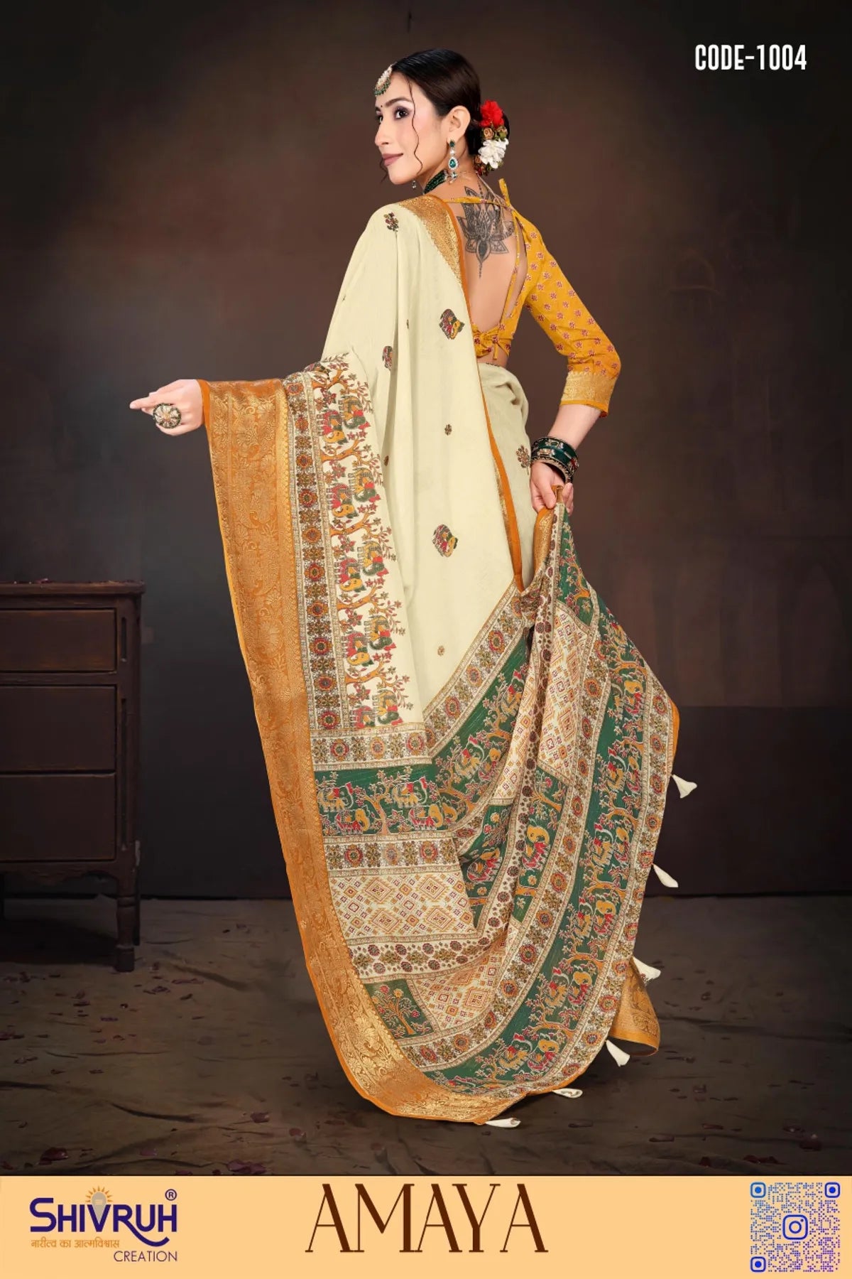 Hand-beaded saree blouse with tassel accents